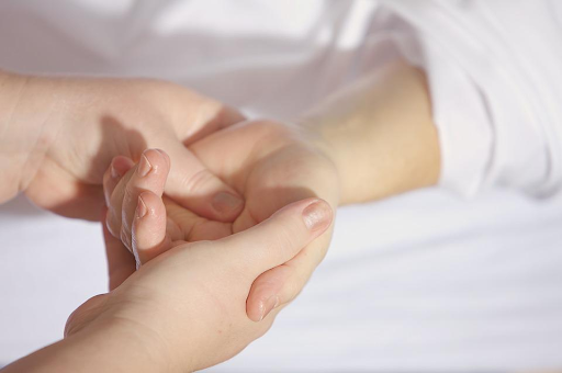 A firm and youthful hand being massaged.